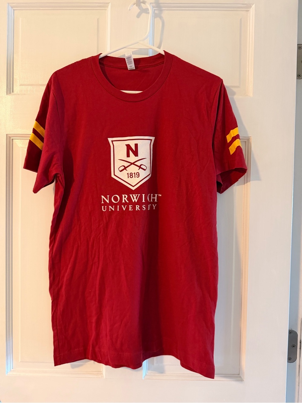 Bella Canvas Red Norwich University Crest Tee with Yellow Sleeve Stripes
